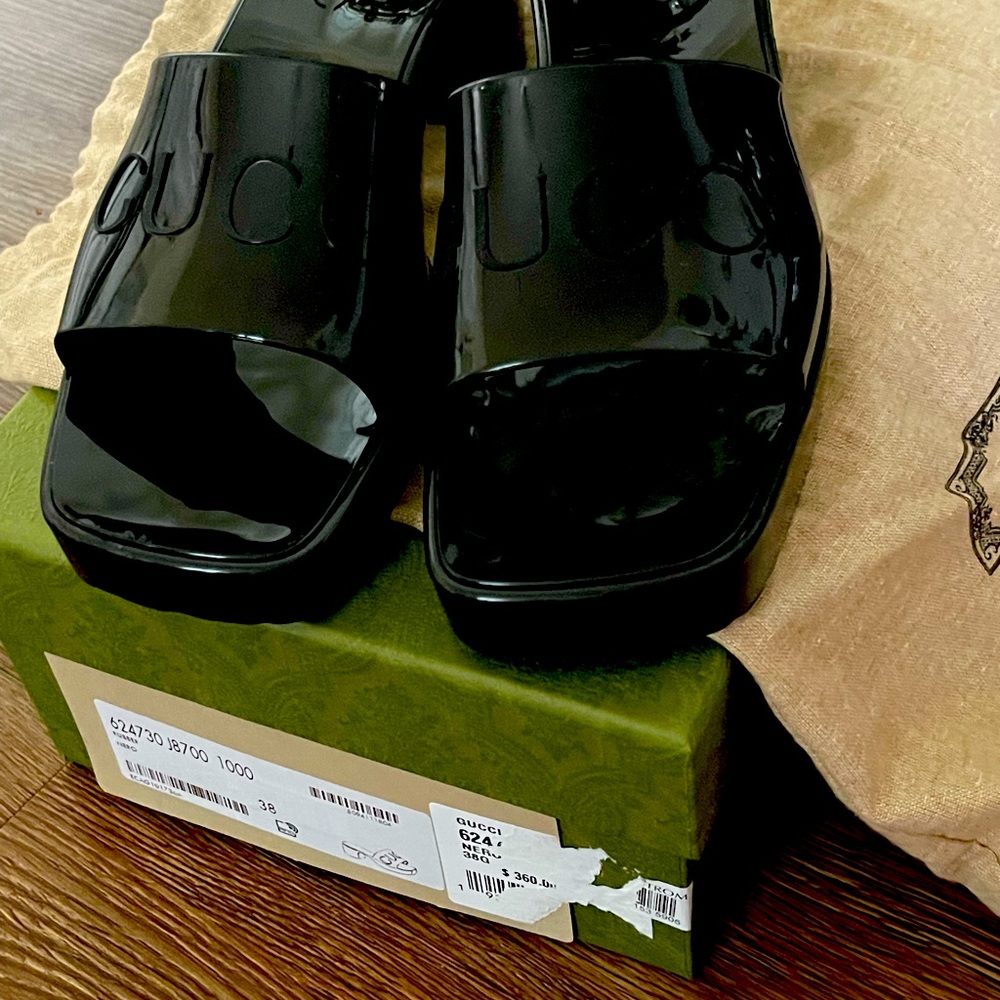 Gucci Slides. Barely worn. Slides come in original box with dust bags.